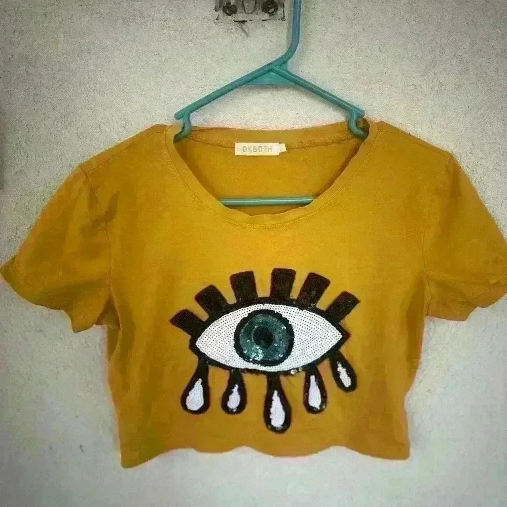 Cropped eyeball graphic tee. Size large. Sequins